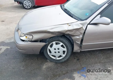 1999 Toyota Corolla Le from USA, damaged, VIN 2T1BR12E4XC255182